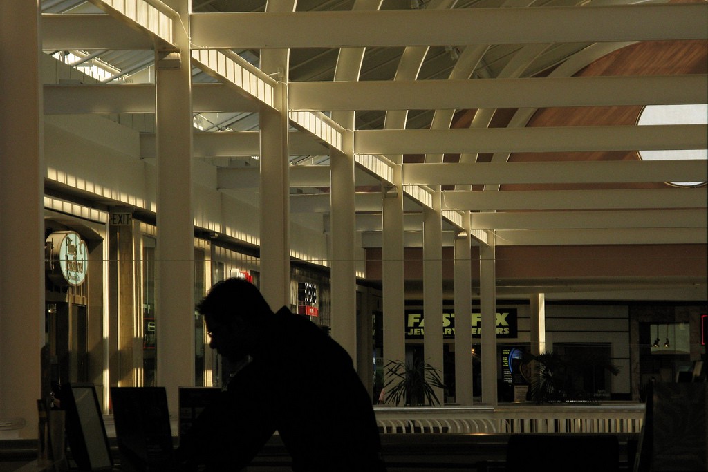 a man laughing alone with commerce